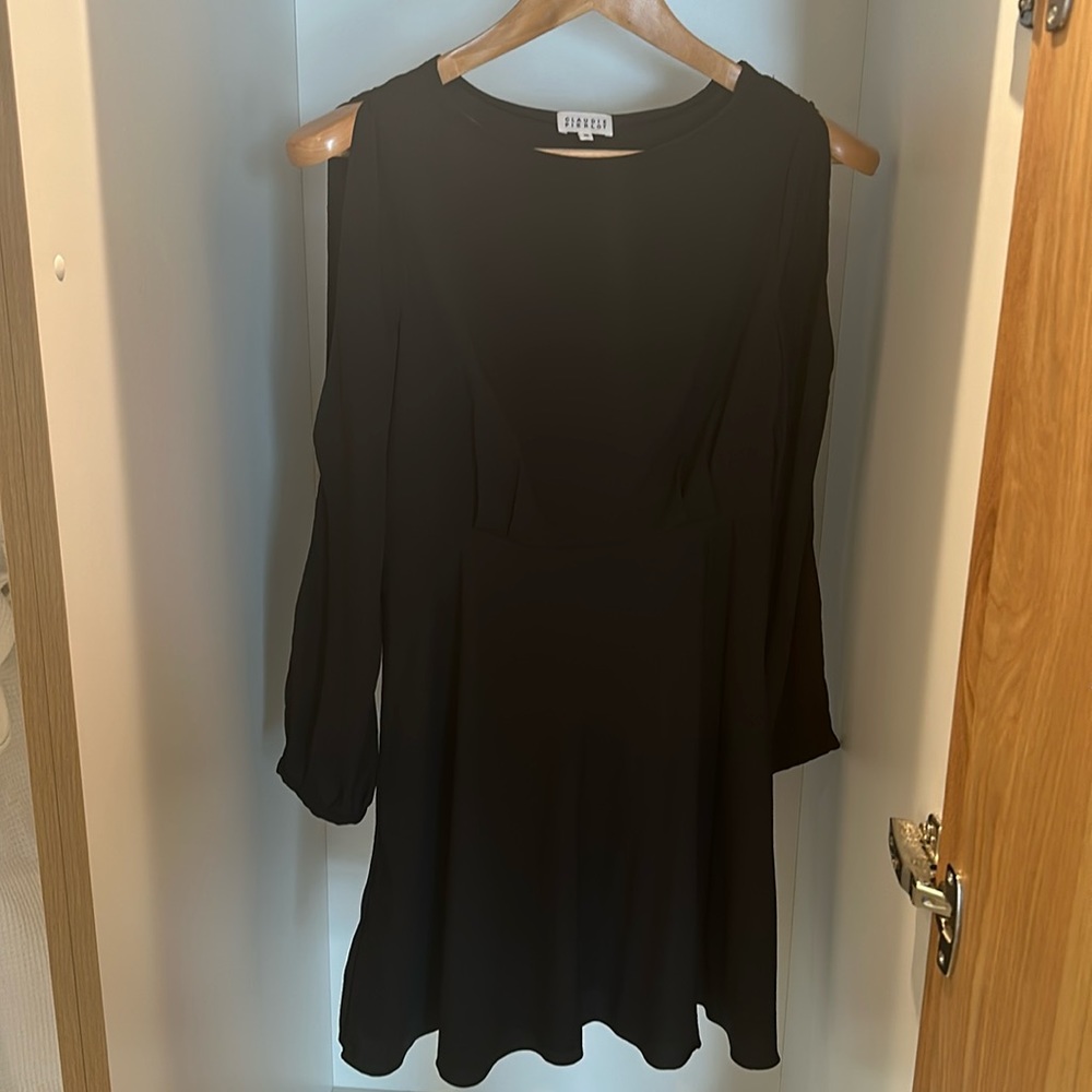 Claudie Pierlot , black above the knee long sleeve with cutout detail.